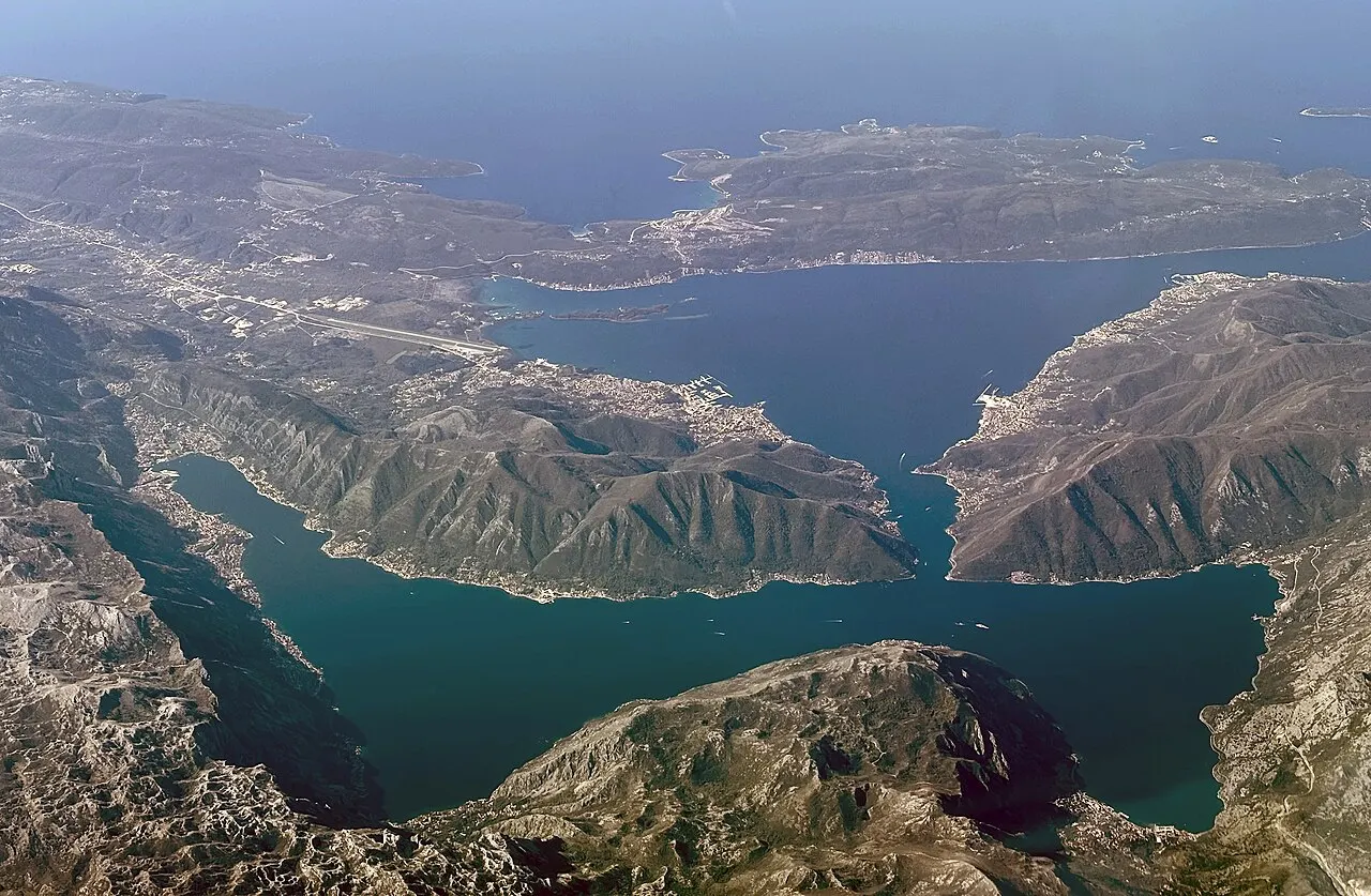 Aerial view down onto the town of Kotor and the inner Bay of Kotor, the whole basin enclosed by mountains