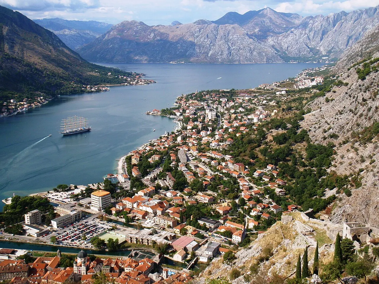 The Bay of Kotor and Old Town from high on the Kale fortress path, the bay sweeping away below ringed by mountains