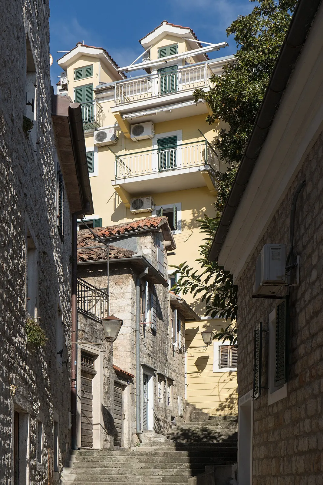 Herceg Novi old town stepping down toward the sea below stone fortress walls