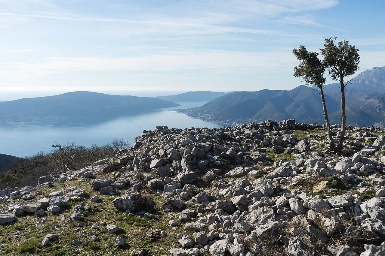 The Bay of Kotor seen from the rocky Vrmac ridge at Sveti Ilija Peak, drystone ruins in the foreground