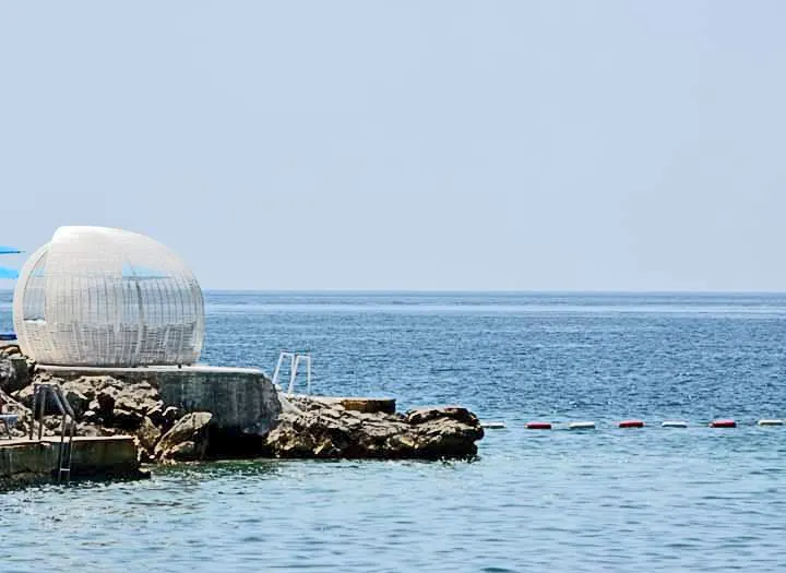 Žanjice beach on the Luštica peninsula, white pebbles on the open-sea cove