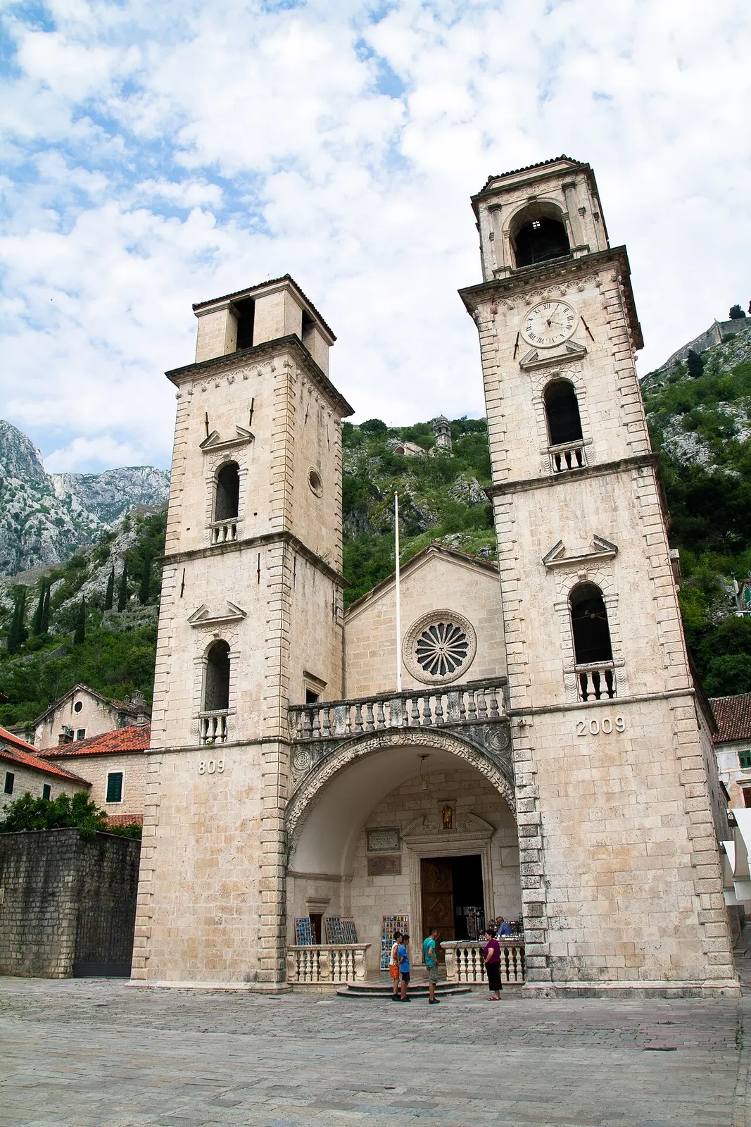 The twin Romanesque towers of St Tryphon's Cathedral above its square in Kotor