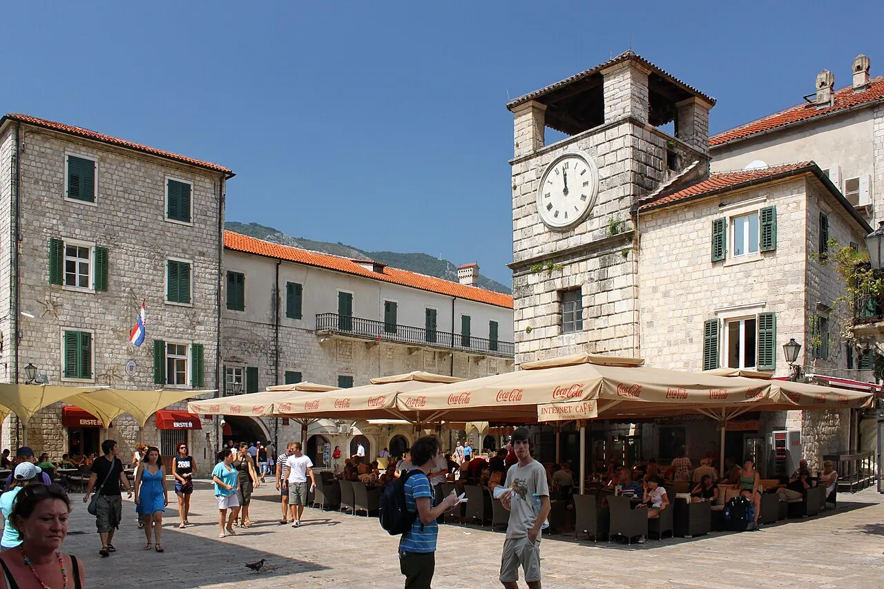 Arms Square (Trg od oruzja) in Kotor's Old Town with the clock tower and cafe tables