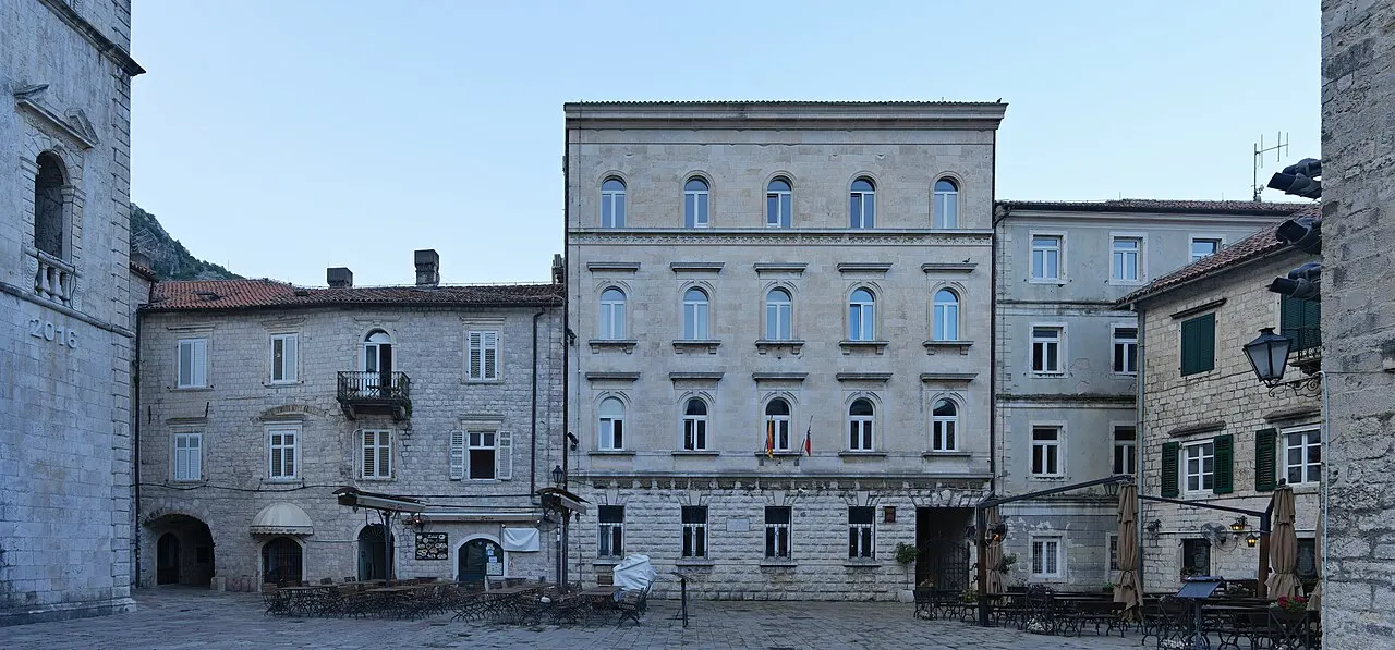St Tryphon Square in Kotor Old Town in soft evening light with quiet cafe tables