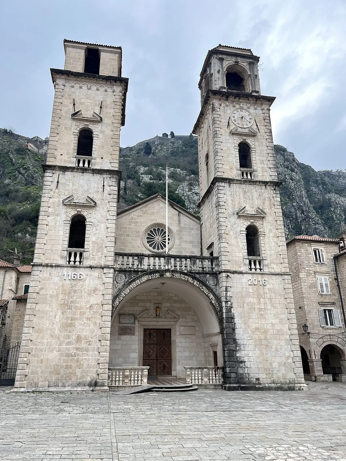 The twin stone towers of the Cathedral of Saint Tryphon in Kotor, rebuilt after earthquakes