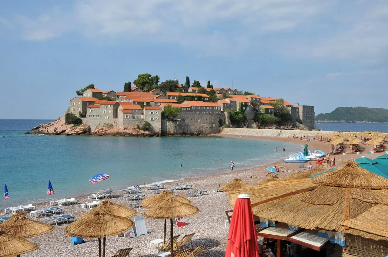 The fortified islet of Sveti Stefan joined to the shore by its slim causeway