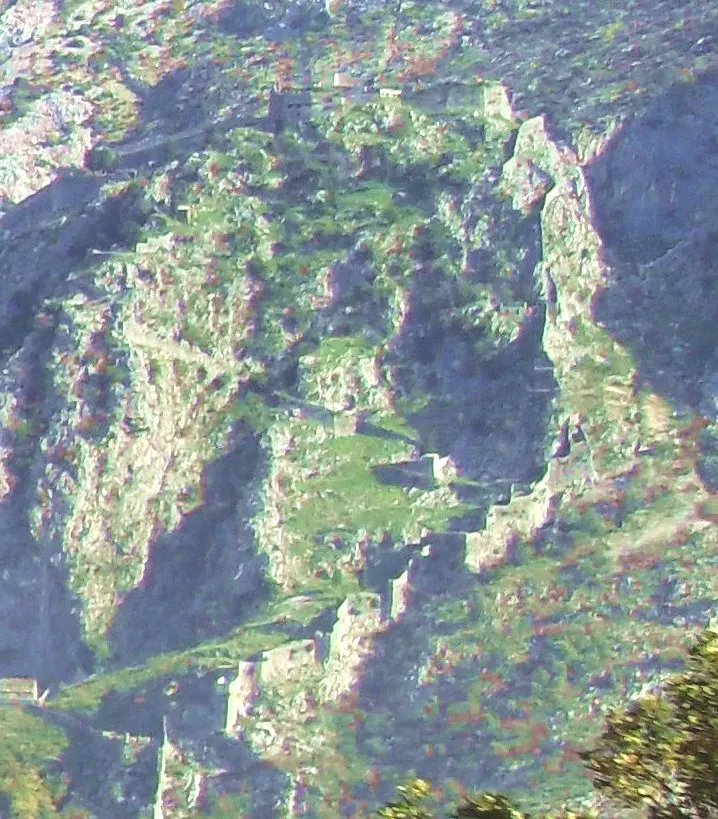 Kotor's city walls zigzagging up the cliff to the Castle of St John above the Old Town roofs
