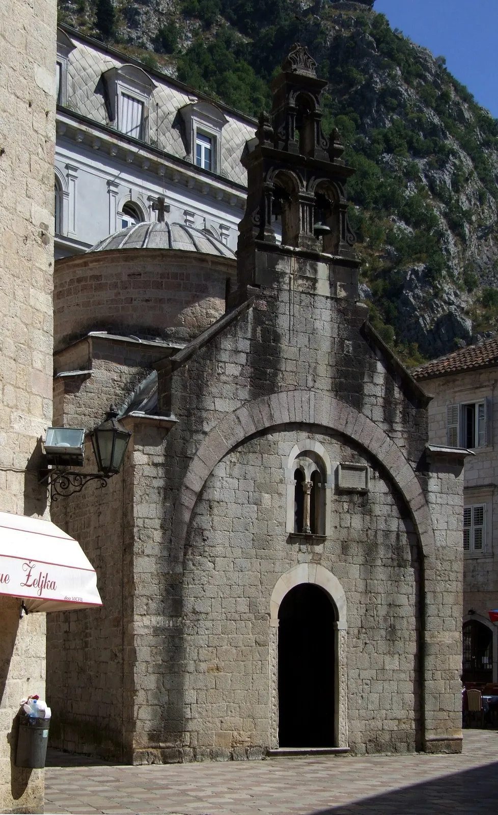 The small stone facade of St Luke's Church on its quiet square in Kotor's Old Town