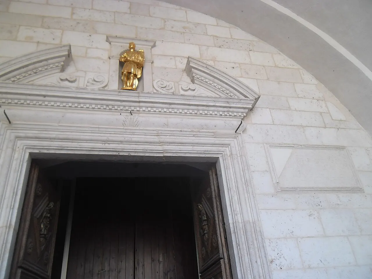 The main doorway of St Tryphon's Cathedral seen from the square in Kotor