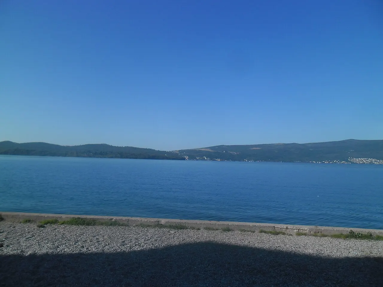 A bayside view over Tivat and its harbour, the wider Bay of Kotor and mountains beyond