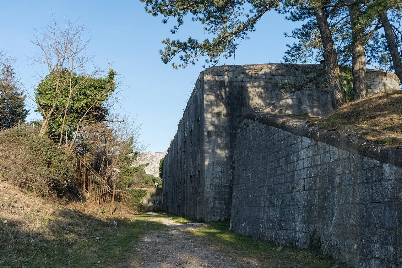 The stone-and-concrete ruin of Fort Vrmac on the ridge crest above Kotor