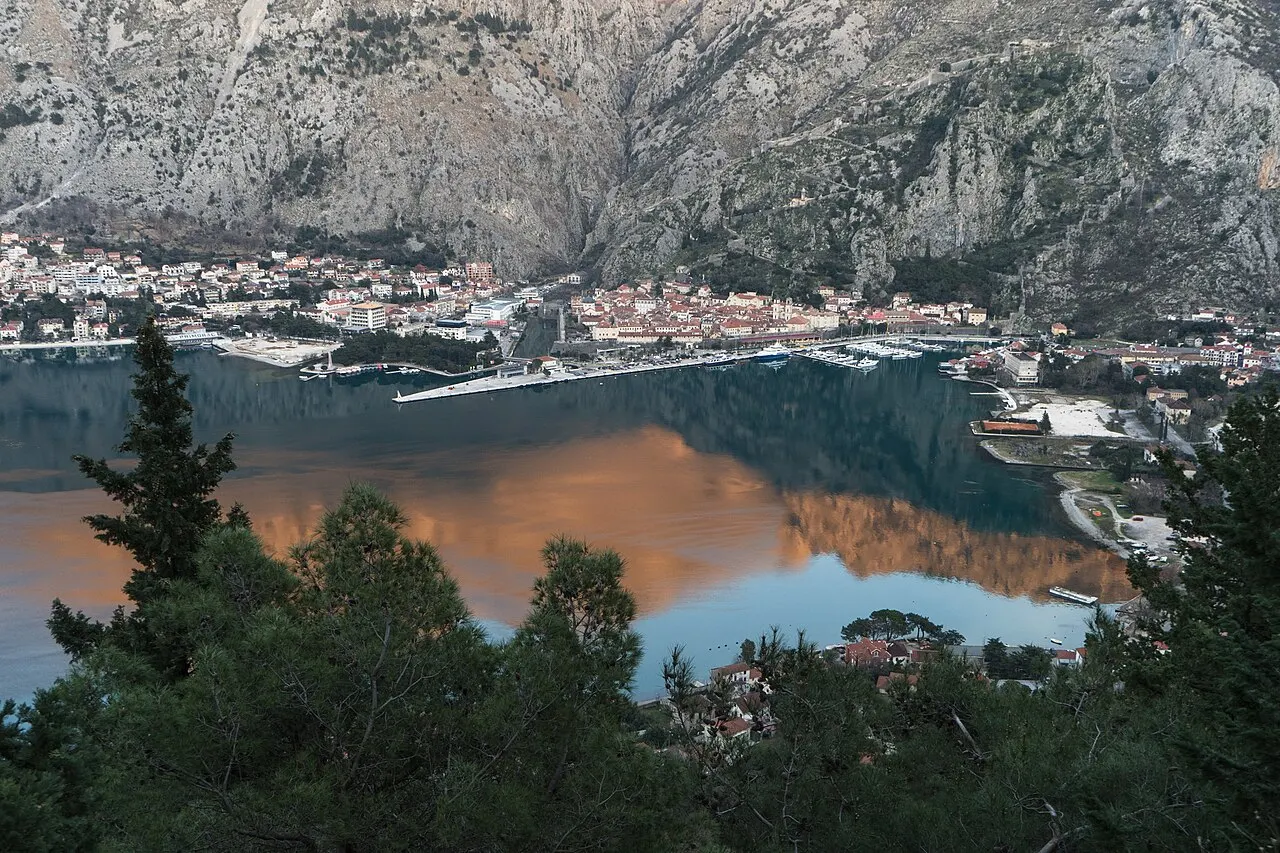 Kotor's rooftops and the bay seen from the trail climbing to Fort Vrmac