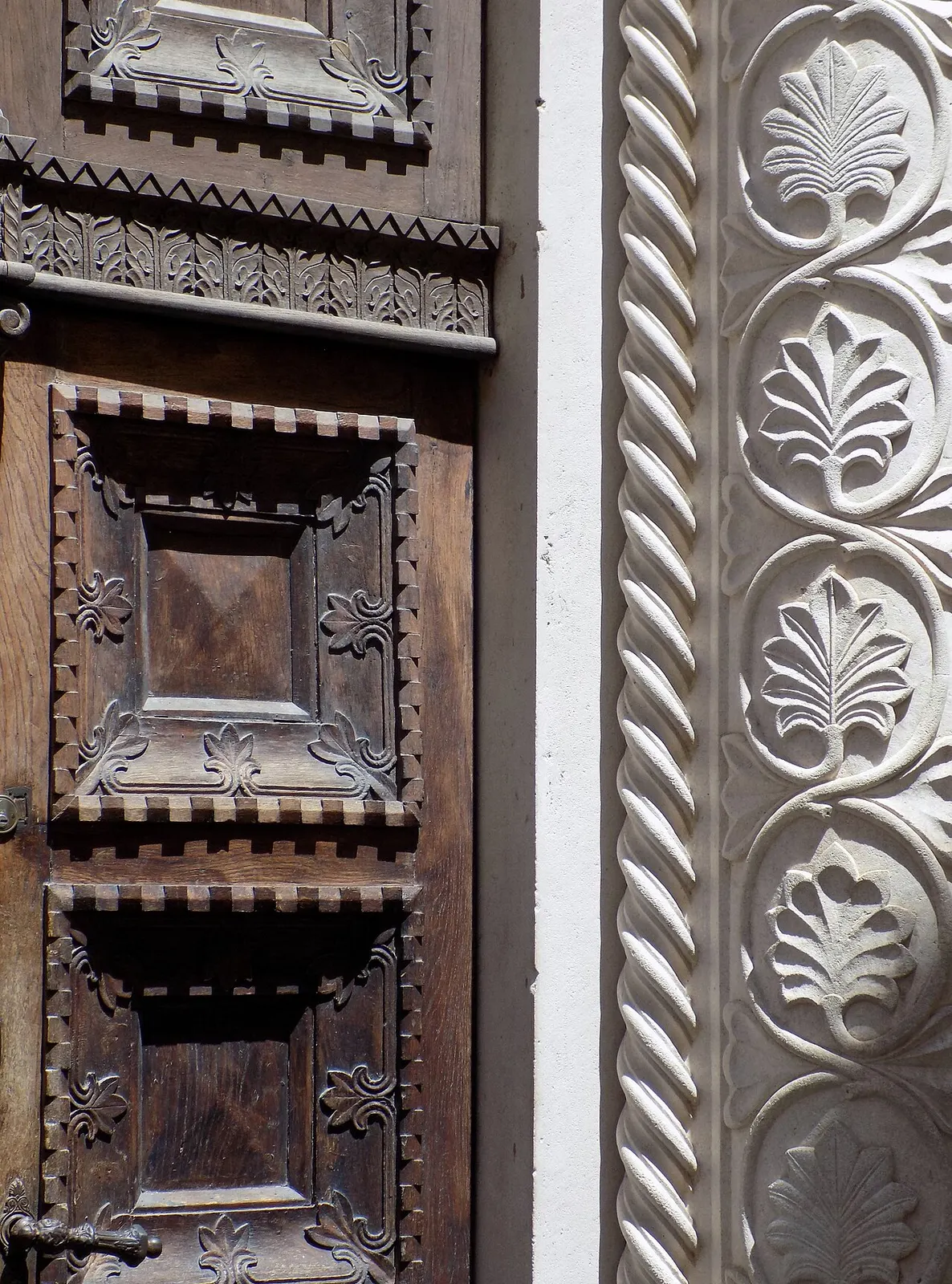Weathered medieval wooden door and stone doorway in Kotor's Old Town